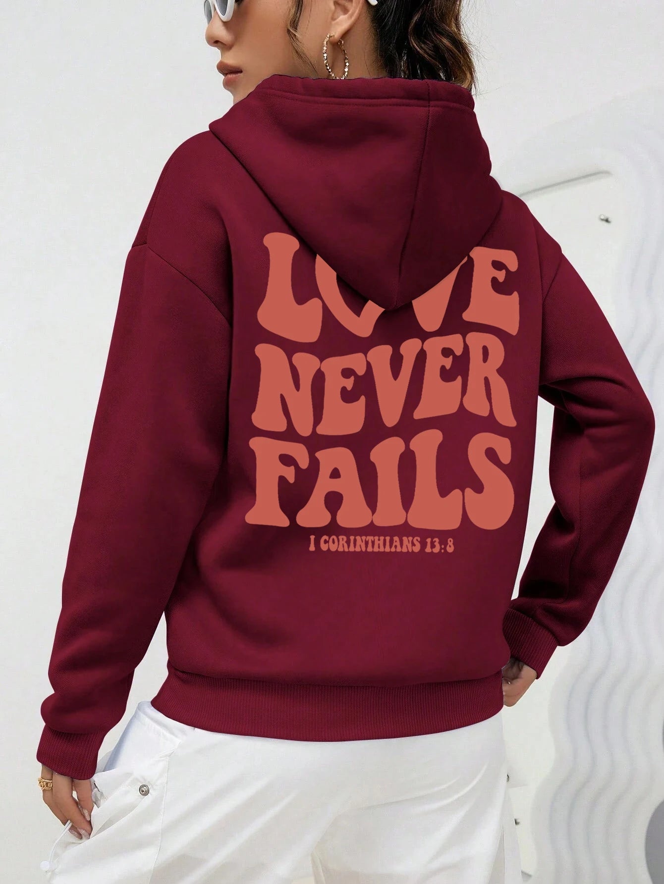 Women's fashionable, warm hooded Love Never Fails, hoodie