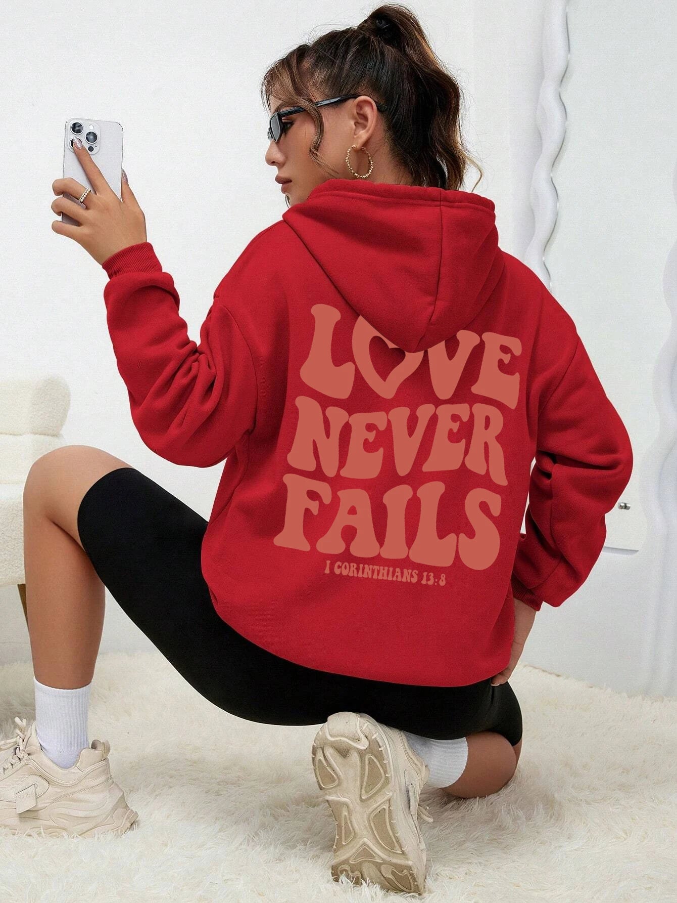 Women's fashionable, warm hooded Love Never Fails, hoodie